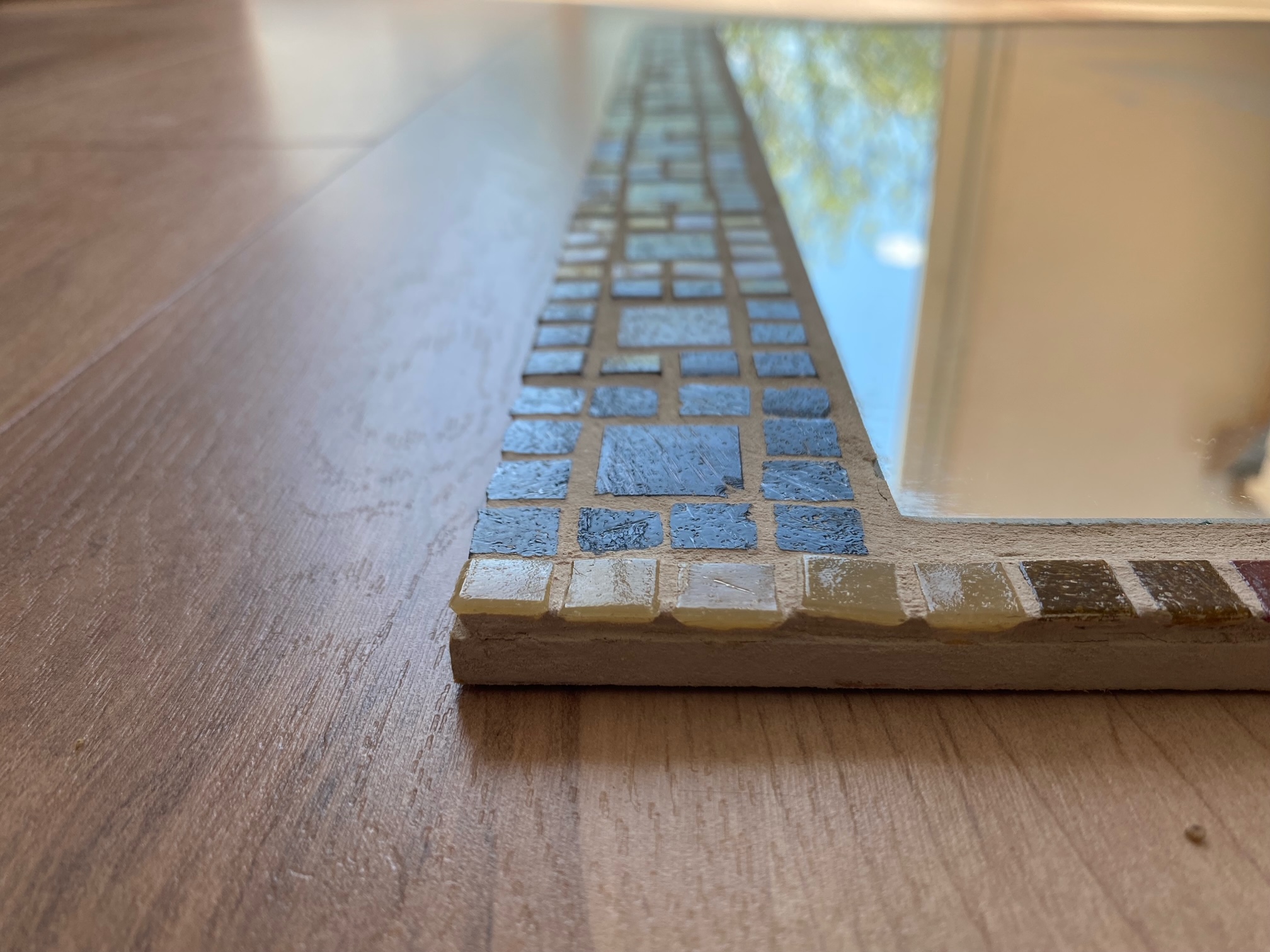 Two each of gray, white, and black shirts laying flat.