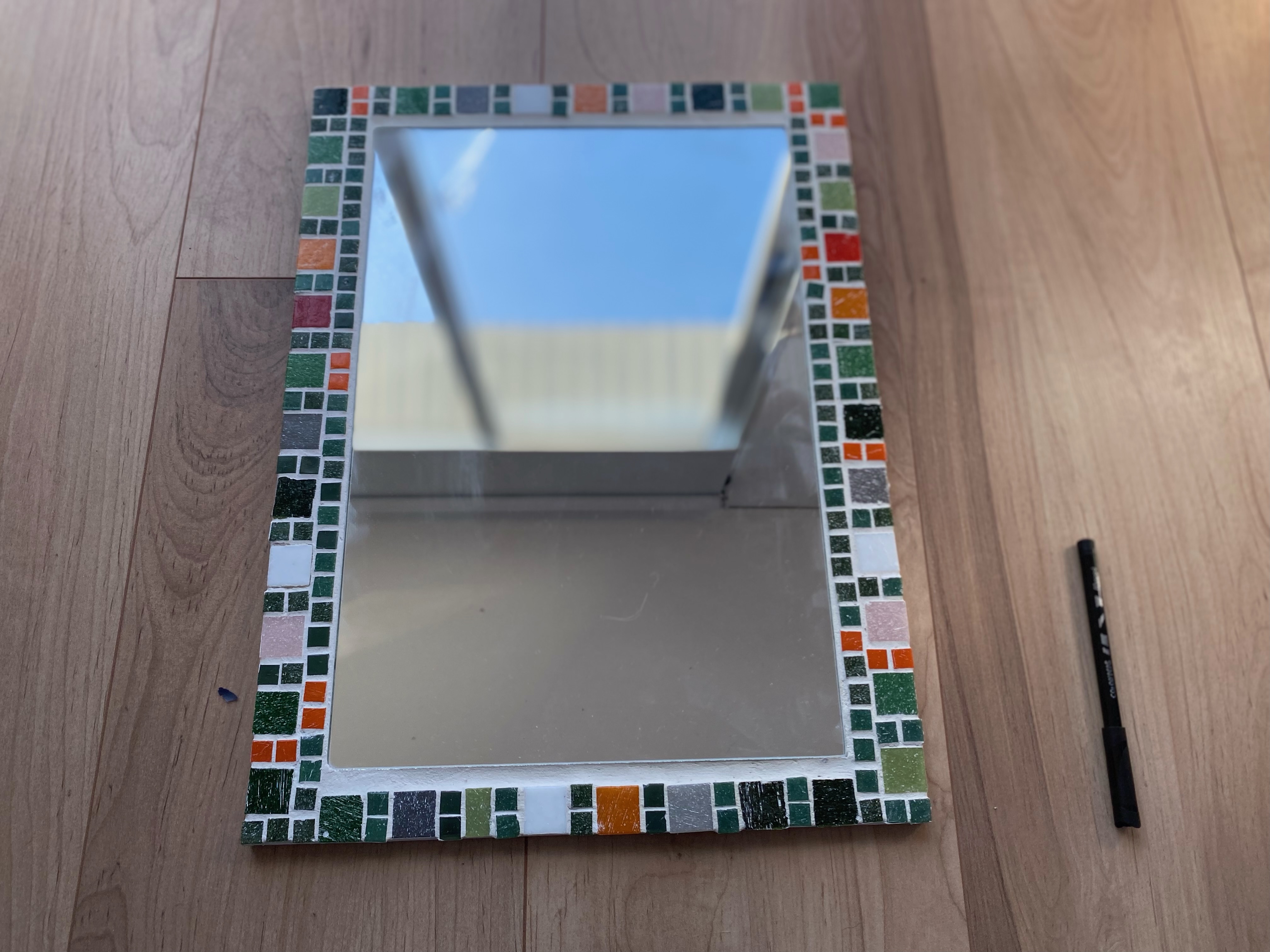 Two each of gray, white, and black shirts laying flat.