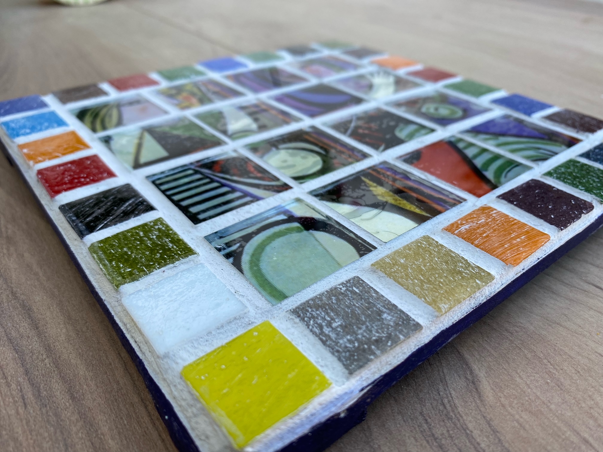 Two each of gray, white, and black shirts laying flat.