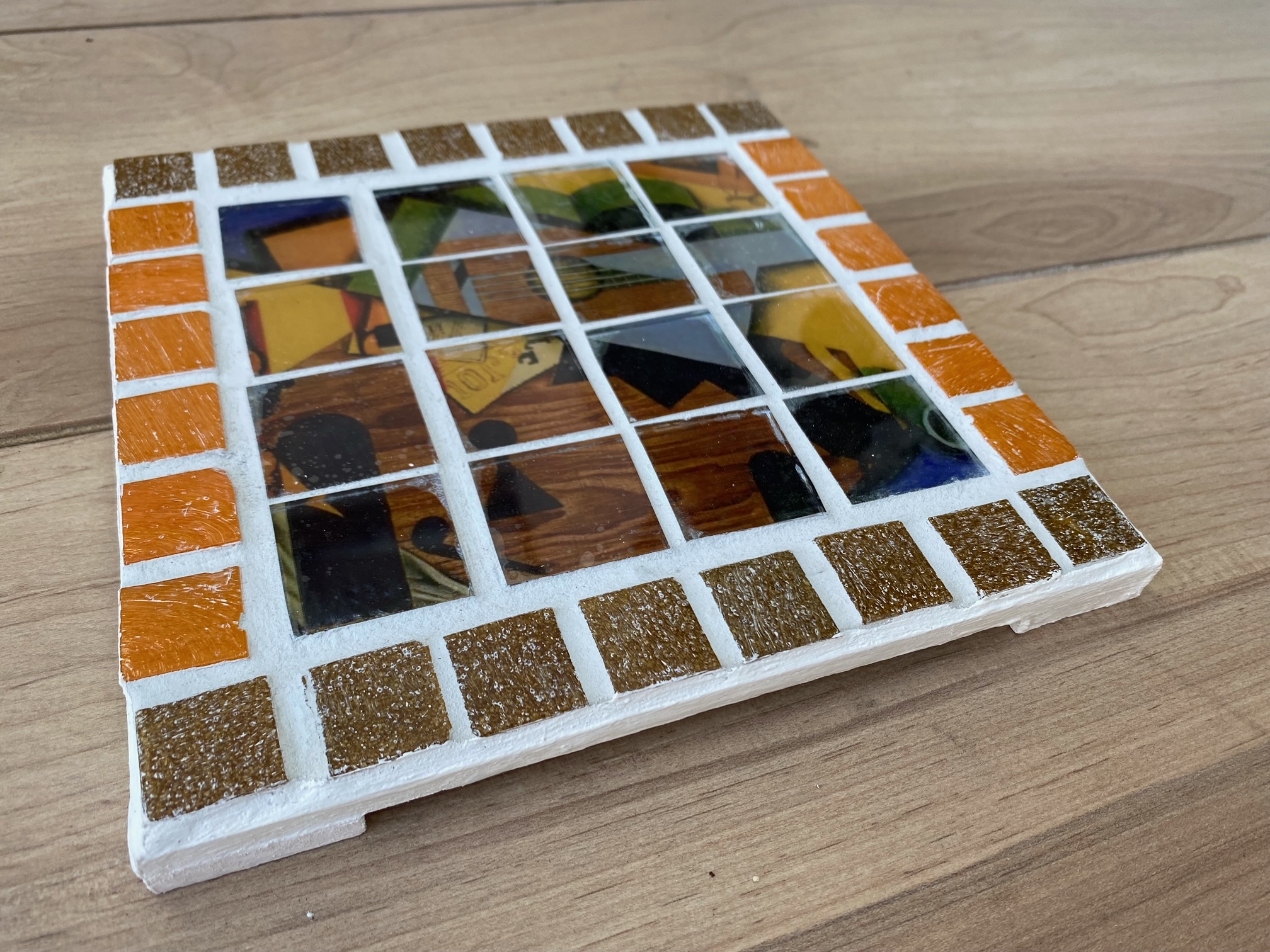 Two each of gray, white, and black shirts laying flat.