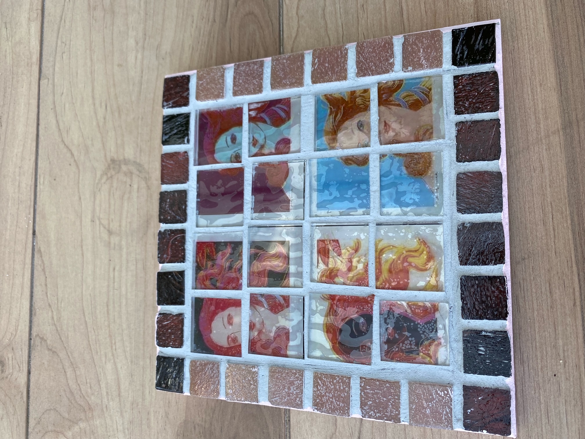 Two each of gray, white, and black shirts laying flat.